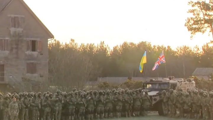 Ukrainian recruits in England conduct sunrise parade