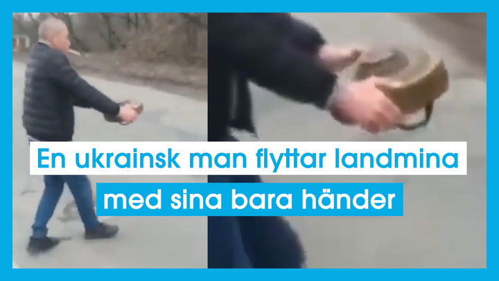 En ukrainsk man flyttar landmina med sina bara händer