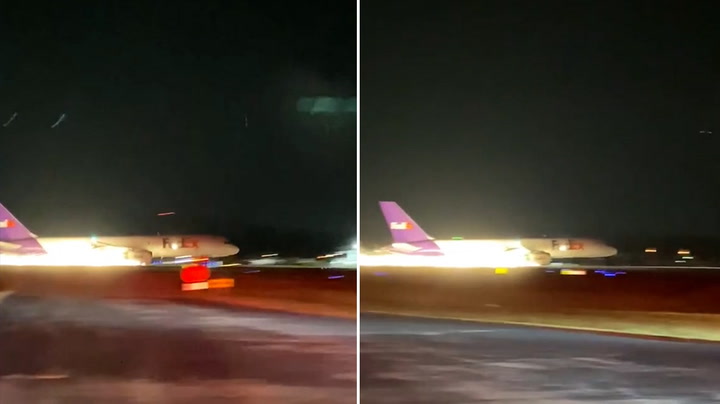 Sparks fly from FedEx plane as it makes emergency landing