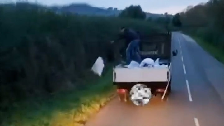 Fly-tipper brazenly throws bags of rubbish into countryside lane