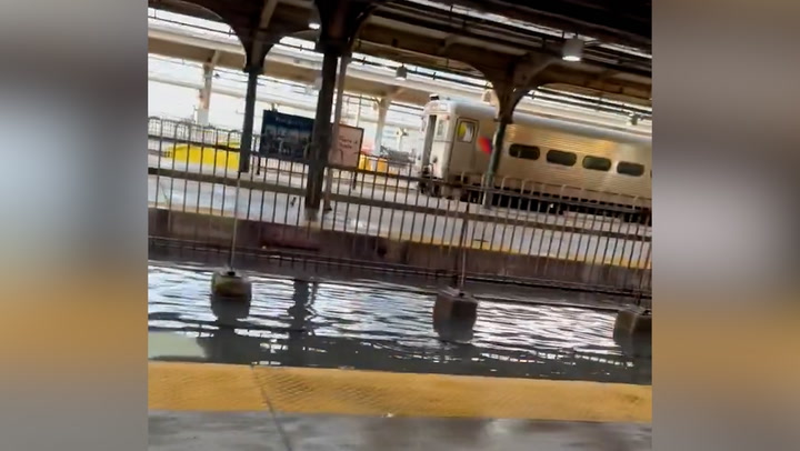 New Jersey train station floods after winter storm brings torrential rain