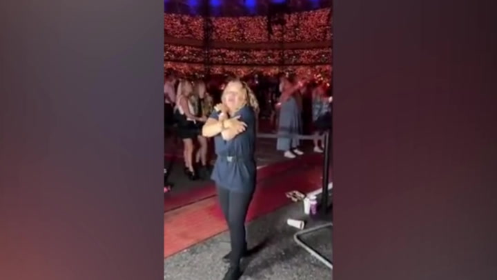 Sign language interpreter performs at Coldplay concert