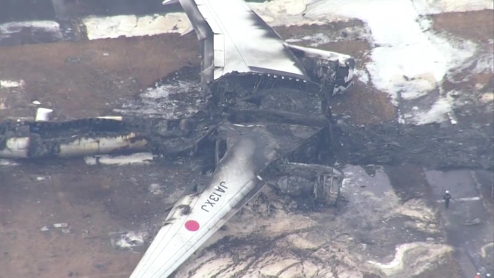 Aerial footage of Japan aircraft wreckage reveals extent of deadly plane fire