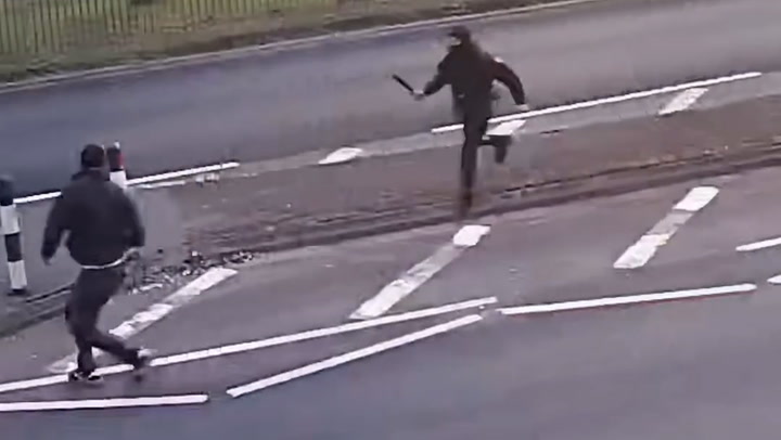 Father's last moments protecting son caught on CCTV minutes before he is stabbed