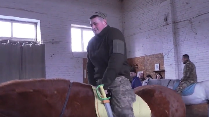 Ukraine soldiers ride out war stress with animal therapy