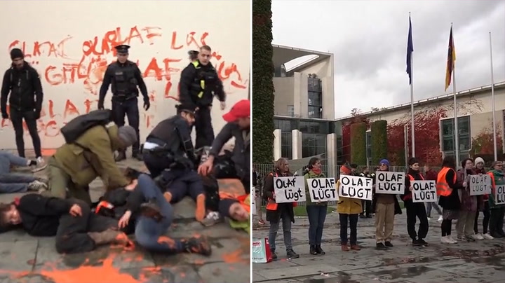 Climate activists paint message to German chancellor during latest Berlin protest