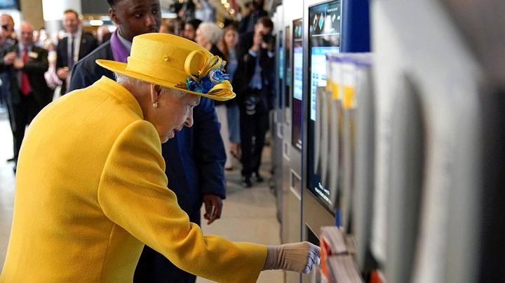 Queen shown how to top up Oyster card during surprise visit to Paddington station