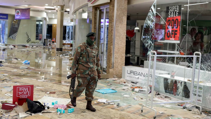 Police in South Africa try to control protesters, looters