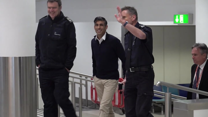 Sunak laughs with Border Force officers after Rwanda bill passes through Commons