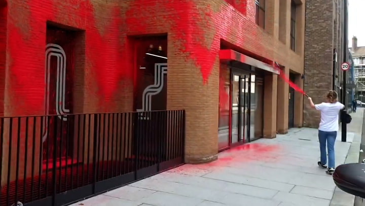 Moment protesters spray red paint over Labour headquarters