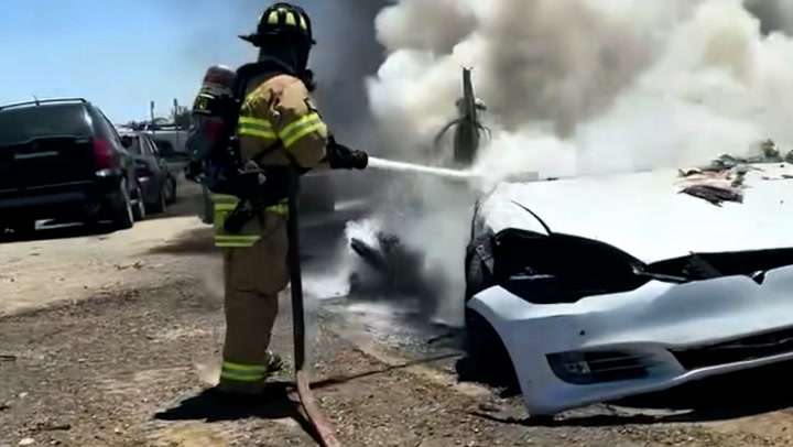 Tesla goes up in flames as firefighters struggle to extinguish battery fire