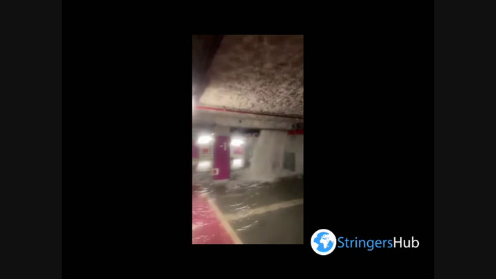 Floodwater cascades into shopping mall car park in France