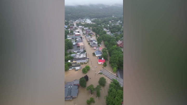 US town submerged by catastrophic flooding captured in drone footage