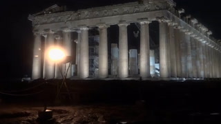 Cauldron atop Athens Acropolis lit with Olympic torch as relay arrives