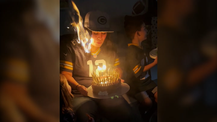 Mother sets hair on fire as she blows out birthday candles