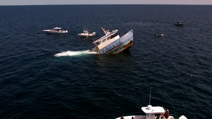 Moment ship is intentionally sunk off Florida coast to create artificial reef