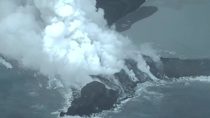 Japanese volcano spews spectacular ash and smoke plumes