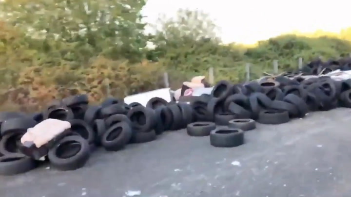 Two of Britain's worst fly-tippers caught in the act dumping rubbish on road