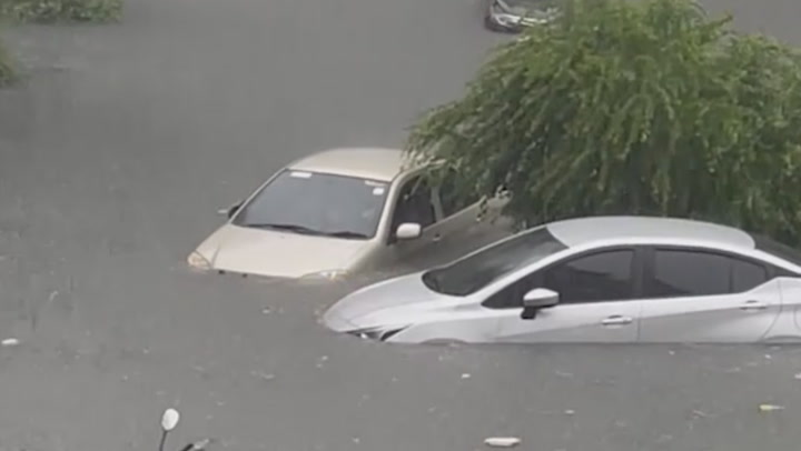 Flooding submerges cars in Bangkok following Typhoon Noru