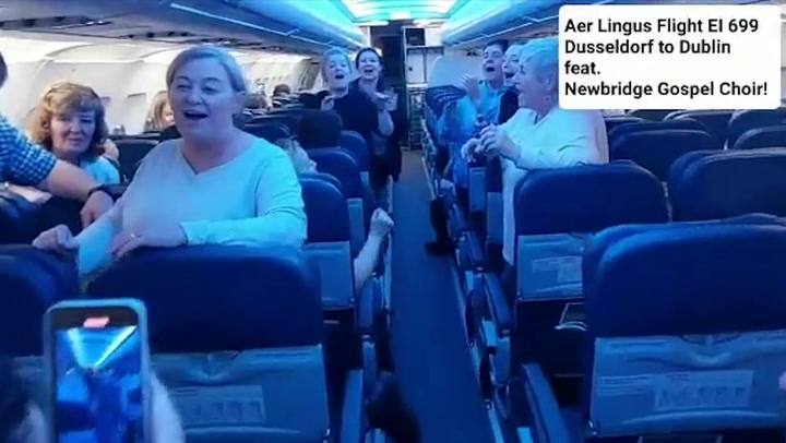 Gospel choir surprises plane passengers by singing on board