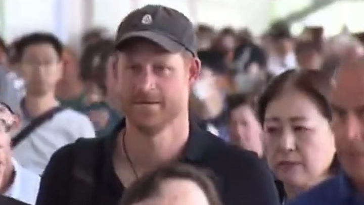 Prince Harry sports Archewell hat as he arrives in Tokyo
