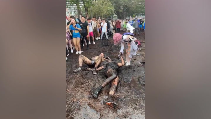 Ultra Miami attendees roll around in mud before festival evacuated due to weather