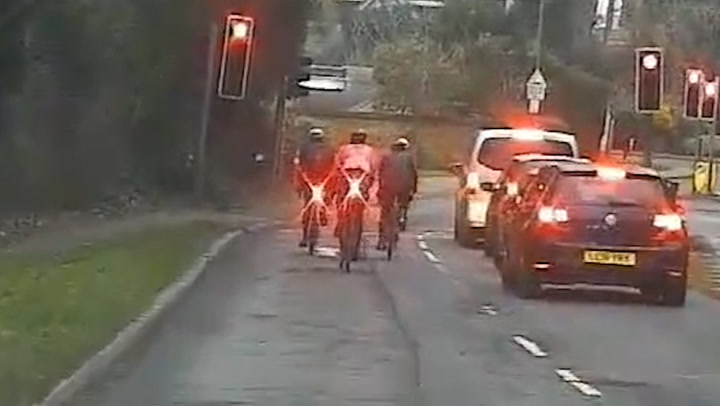 Cyclists fined after being caught riding through red light by unmarked police car