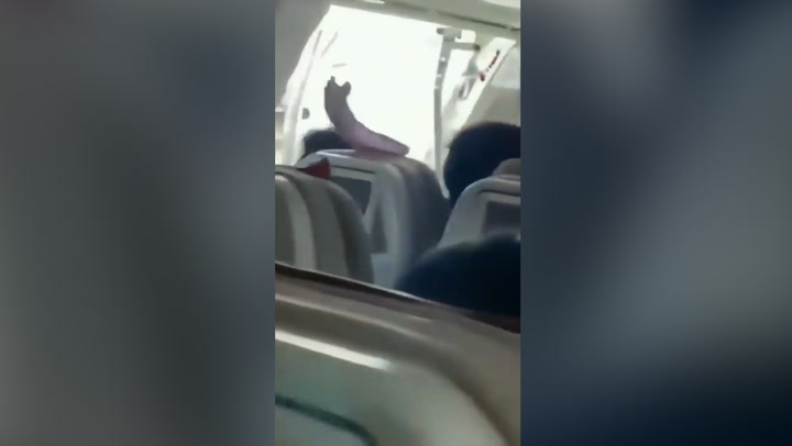 Terrifying moment plane door opens mid-flight