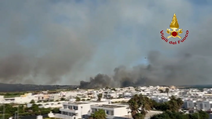 Smoke billows from wildfire burning close to homes in Lecce