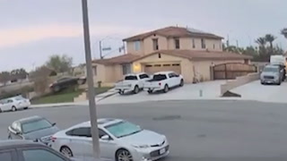 Out-of-control car flies into garage on quiet California street