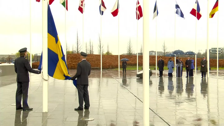 Sweden flag raised at Nato headquarters to cement place as 32nd alliance member