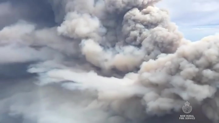 Sky fills with towers of smoke as wildfires rage on ground in Australia
