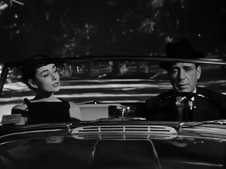 Humprey Borgart y Audrey Hepburn en una escena de Sabrina (1954)