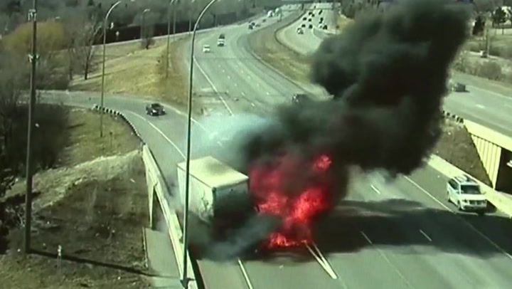 Lorry bursts into flames after being hit by out-of-control car on Minnesota overpass
