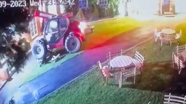 Moment speeding digger smashes into through garden and ploughs The Mucky Duck pub